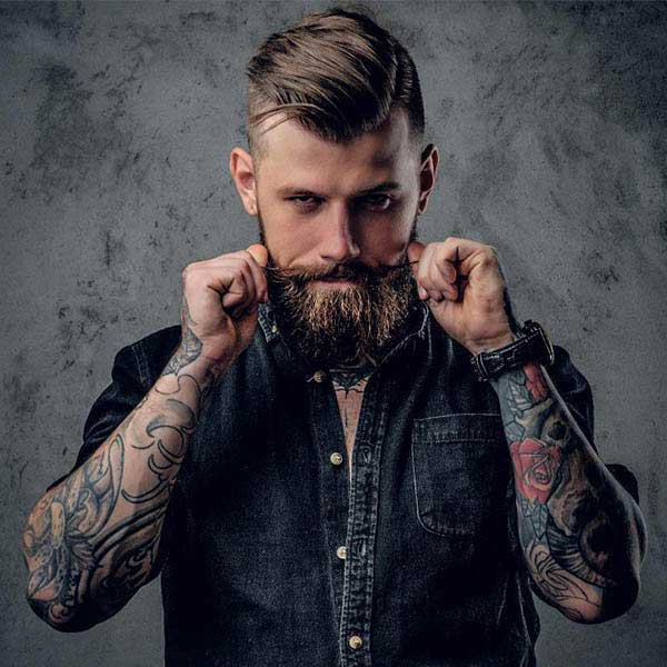 Barber finishing a client cut with detail work